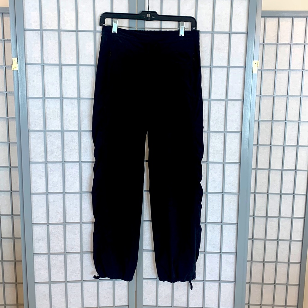 Athleta black joggers with elastic waist and pull tabs at ankles. Size 4